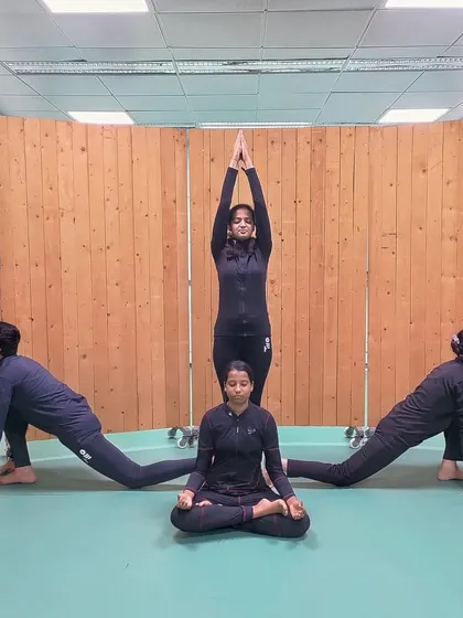 Another artistic group yoga pose, symbolizing unity and strength. These activities build camaraderie and a positive team spirit.