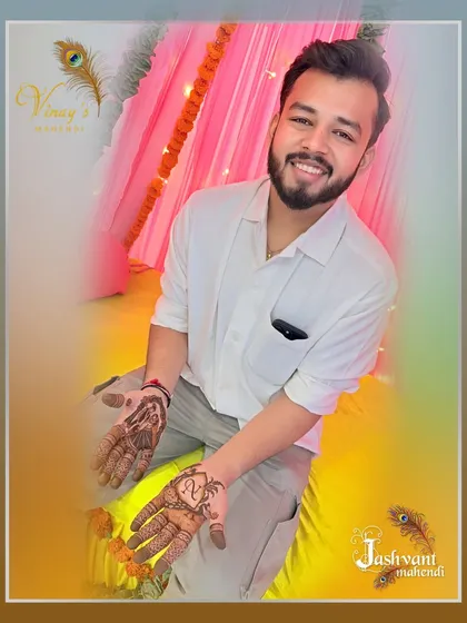 The groom smiling, ready for the wedding festivities with his personalized henna.