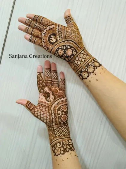 A side view of the Ganesh Chaturthi design, showing the intricate bands and motifs that wrap around the arm.