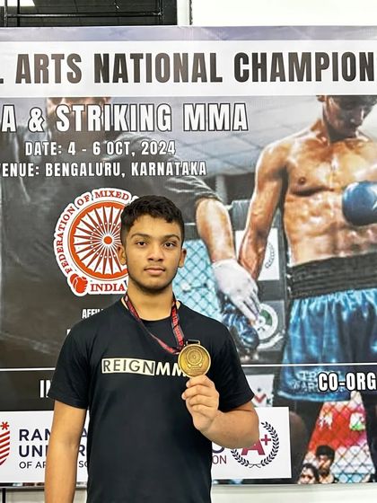 A close-up of a champion. Almeer with his gold medal after his victory at the FMMAI nationals, representing the next generation of fighters built from the ground up at Reign MMA.