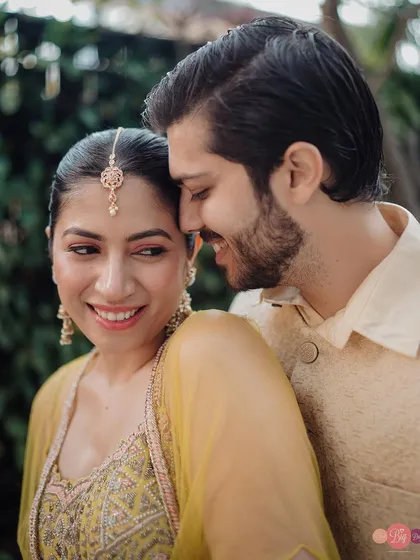 A soft, intimate moment shared between a couple in beautiful traditional attire. We focus on the quiet glances and gentle touches that speak volumes.