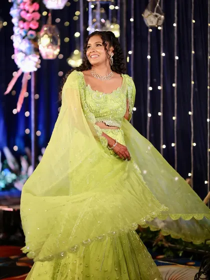 Twirling into the night. This full-length shot showcases her entire Carnival look, with the flowing lehenga and glowing makeup creating a magical effect.