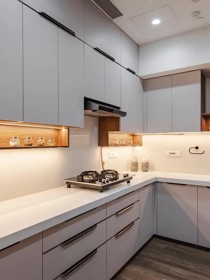 A closer look at the clean lines and high-quality finishes in our Kohinoor Square kitchen. The combination of closed cabinets and open wooden shelving offers both storage and display options.