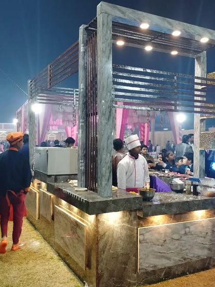 A chef at the live station, focused on preparing a dish. This highlights the fresh, on-the-spot cooking that makes my catering service special.
