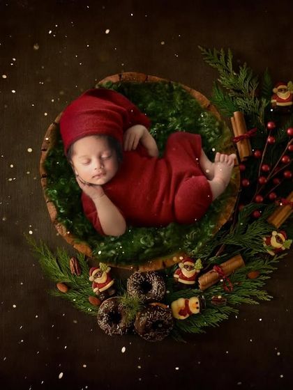 This little elf is sleeping soundly in a Christmas wreath. The rich red and green colors make this a warm and festive holiday portrait.
