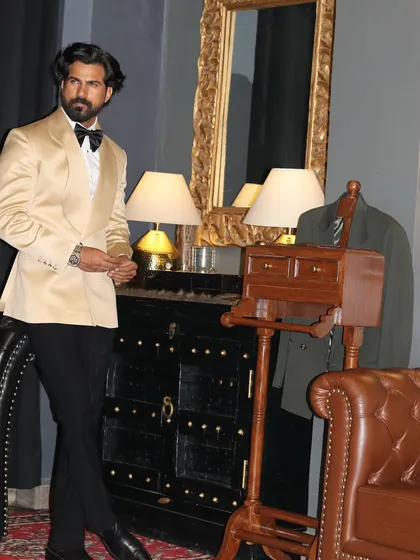 Another angle of the elegant ivory tuxedo, showing its versatility in a classic, refined setting.