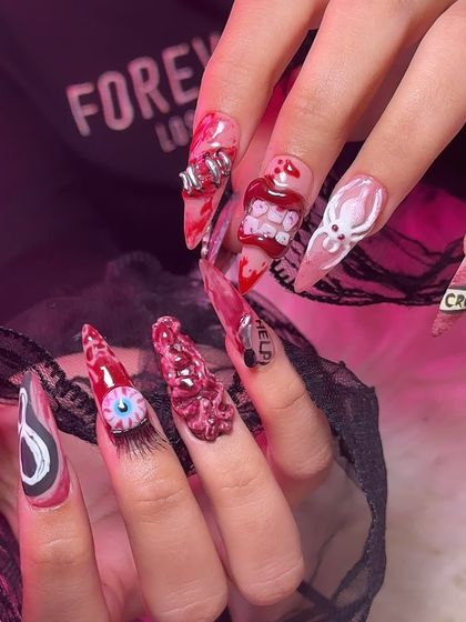 A full look at both hands of this epic Halloween manicure, showing all the different spooky elements working together.