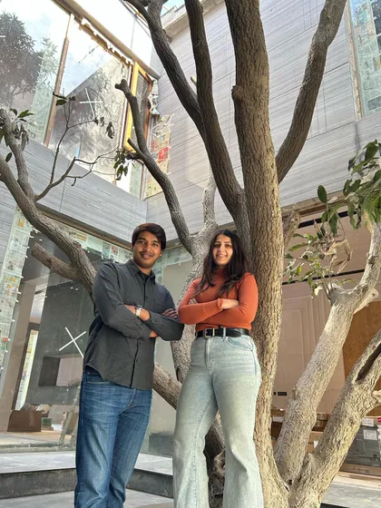 My co-founder and I standing beside a mature tree that was carefully preserved during the construction of Mango Court House. This reflects our core belief in designing with nature, not against it.