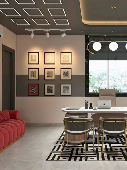 This office design balances professional and comfortable elements, with a bold red sofa adding a splash of color to the otherwise neutral and grey-toned executive space.