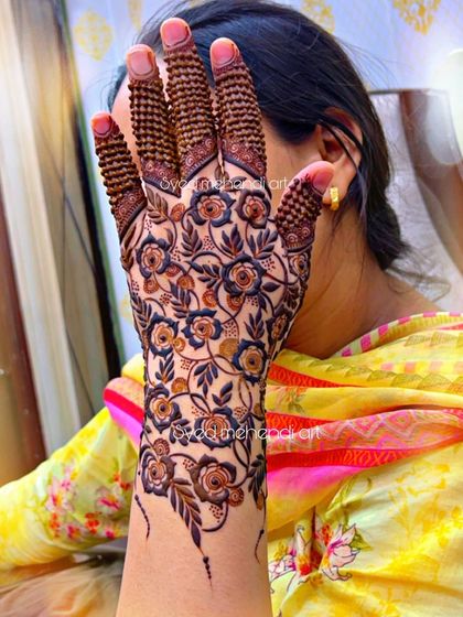 A single hand showcasing the beautiful floral net pattern.