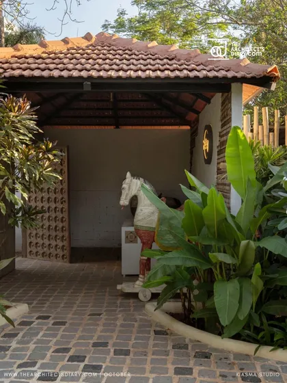 A decorative horse sculpture at the entrance of Sanctuary Bar, adding a touch of eclectic charm to the rustic, tropical landscape.