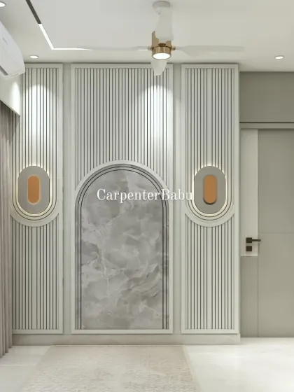A close-up of a wall featuring vertical fluting and an arched niche with a marble inlay. The design is a modern take on classic architectural details.