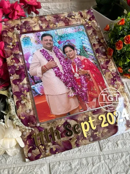 A 9x12 inch rectangular frame preserving a 25th-anniversary garland. The design includes a large photo and the anniversary date in bold golden text.