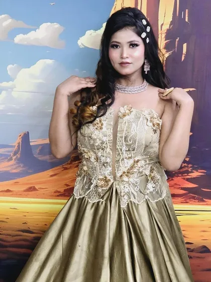 This golden gown with a corset-style bodice is perfect for a glamorous cocktail night. The flowing satin skirt adds a touch of Hollywood elegance.