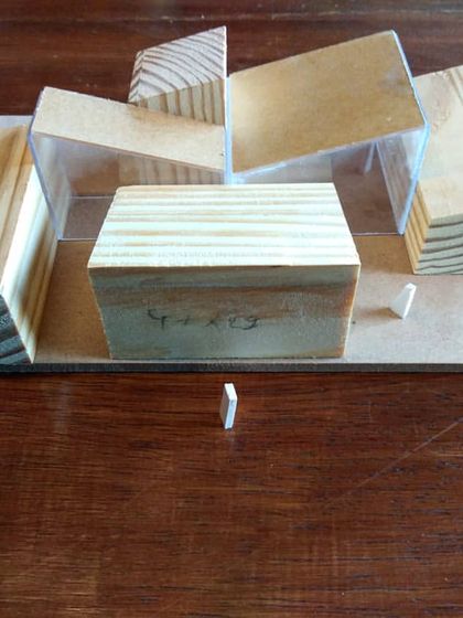 A physical scale model for the Artist Residency in Delhi. Made from simple wood blocks, this model was used to study the massing and geometric relationship between the different sloping roof volumes and the open spaces they create.