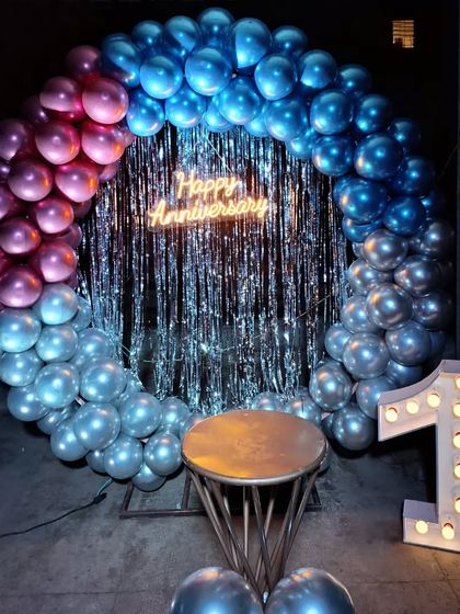 A full view of the first-anniversary balloon ring, a popular choice for creating a celebratory photo booth.