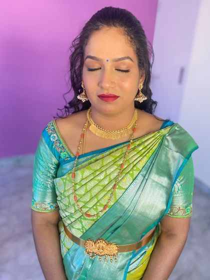 A close-up of the client's makeup with her eyes closed.