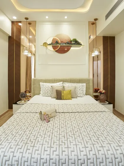 Your bedroom should be a place to unwind and recharge. In this room, I used a calm color palette, custom wall art, and layered lighting to create a serene and restful atmosphere. Notice the mix of textures, from the upholstered headboard to the wooden side panels.