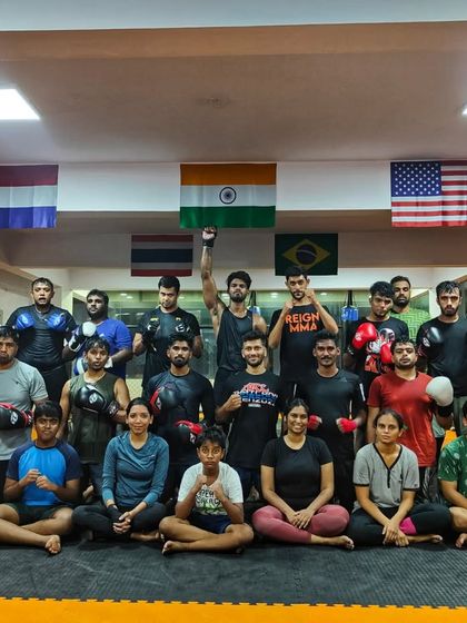 Mid week fury. The team after a Wednesday striking class, with one member raising his fist in triumph.