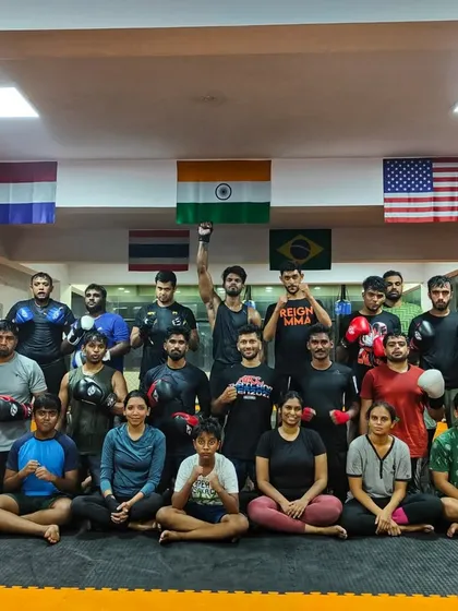 Mid week fury. The team after a Wednesday striking class, with one member raising his fist in triumph.