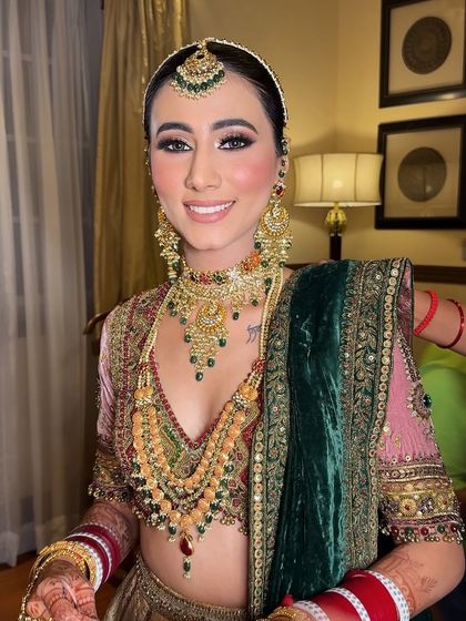 A final portrait of the bride, looking absolutely perfect. The makeup enhances her natural beauty and gives her a stunning bridal glow.