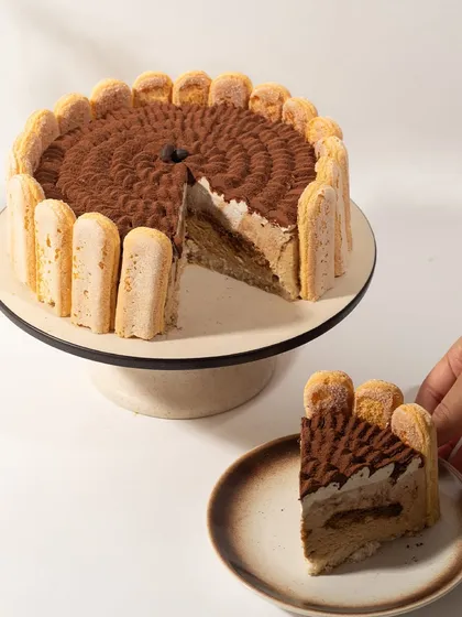 The reveal. This shot shows the beautiful layers of my Tiramisu cake, a testament to its authentic flavor and creamy texture.