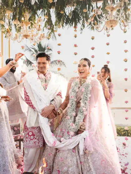 A moment of pure joy and laughter during the pheras. The couple's happiness is infectious, and the candid nature of this shot makes it a cherished memory.