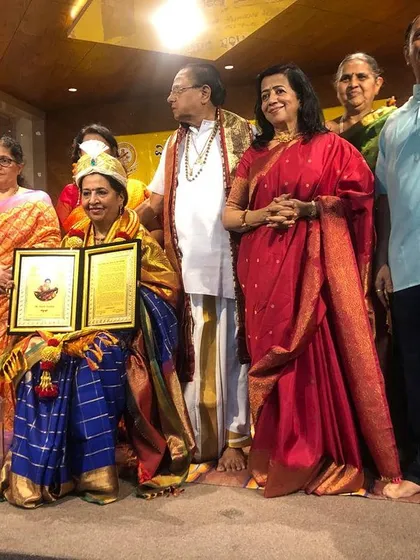 Posing with my award, a symbol of a long and fulfilling career in music. It is a joy to share these moments with the people who have been part of the journey.