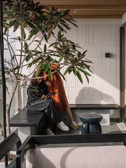 A moment of quiet conversation on the deck, showcasing how the space is designed for human connection.