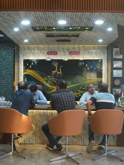 A typical consultation session at our desk. We sit down with our clients to understand their needs and discuss the best solutions.