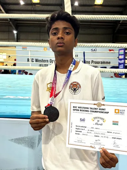 One of my boxers with his bronze medal from the REC Open Talent Hunt Program in Pune, a national-level competition.