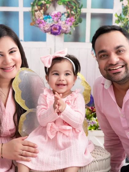 A family united in pink. Coordinating outfits can create a wonderfully cohesive and sweet family portrait, especially with a theme like this butterfly fairy shoot.