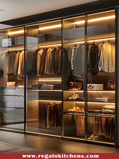 A sophisticated wardrobe with glass doors and warm interior lighting. This design allows you to see your clothing at a glance while keeping it protected from dust.