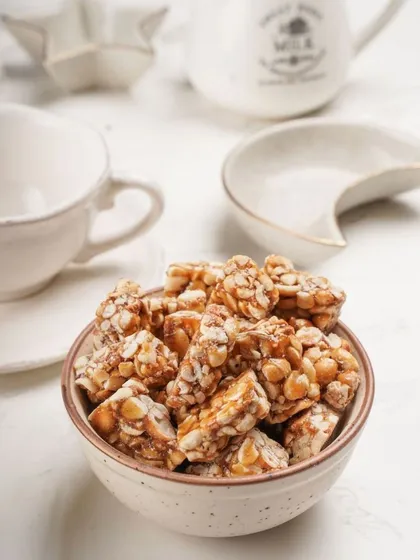 This is my special peanut chikki, the star of my kitchen. I make it in small batches to ensure it has the perfect crunch without being too hard or sticky. It’s a simple, wholesome sweet made with just jaggery and peanuts, exactly how my mother taught me.