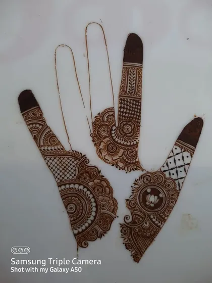 Some of my practice sheets where I experiment with different layouts and motifs. This helps me come up with new ideas for both bridal and party henna designs.