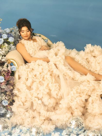 Surrounded by a sea of ruffles and flowers, this portrait feels like a dream. I love creating elaborate, couture setups that make you feel like you're in a fairytale.