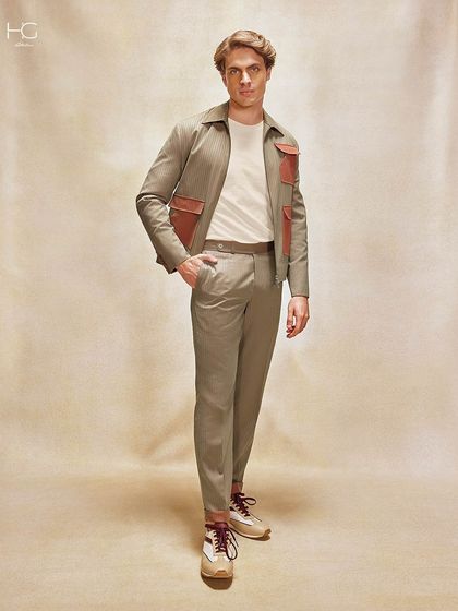 This ensemble, featuring a neutral-toned shacket with contrasting leather pocket details, is designed to capture attention the moment you enter a room with its unique, fashion-forward look.