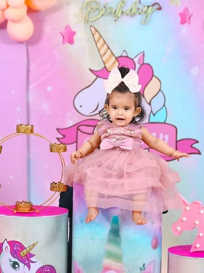 A charming 'Baby Boss' themed birthday party, with a sophisticated black and white color scheme, custom props, and a stylish backdrop, perfect for a little executive.