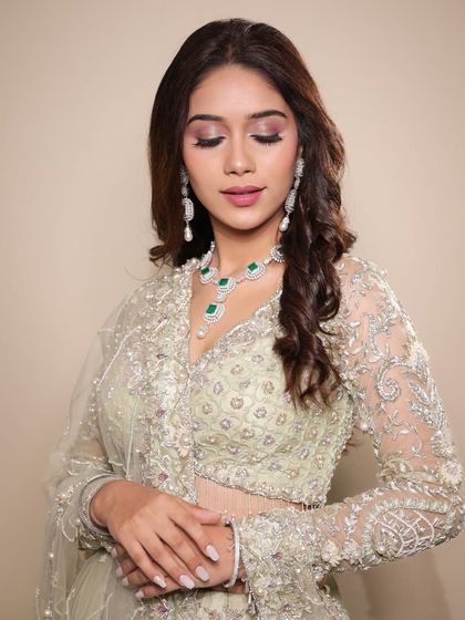 Another beautiful shot from the masterclass promotion, highlighting the flawless base and elegant jewelry pairing.