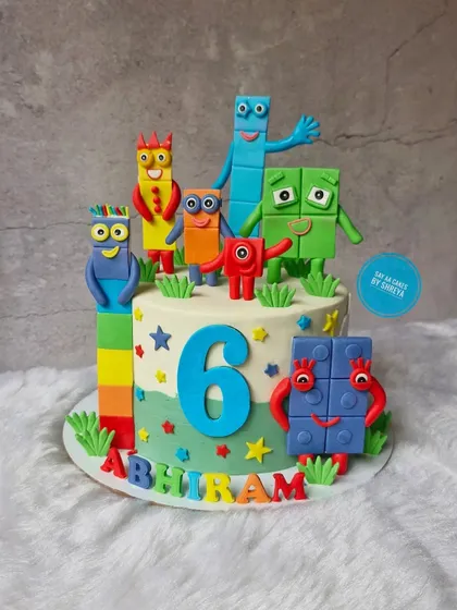 Learning is fun with this Numberblocks cake. I created a whole cast of the colorful characters from the show using fondant, making this a fun and educational theme for a 6th birthday.
