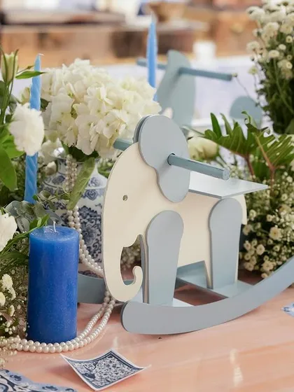 A rocking elephant prop adds another playful element to the decor.