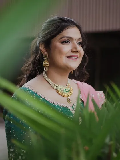 A lovely candid shot of the Mehendi bride. Her makeup is soft and natural, enhancing her features while maintaining a fresh, effortless feel.