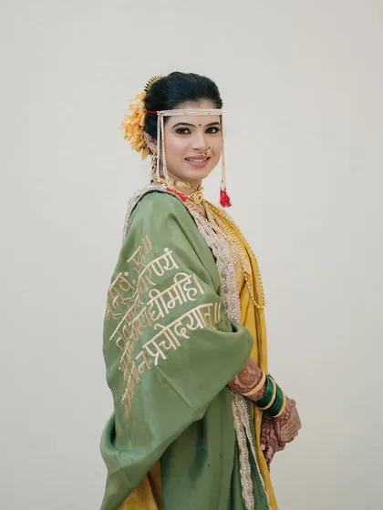 A portrait showcasing the unique, custom embroidery on the bride's shawl. We pay attention to these personal details that make each wedding unique.