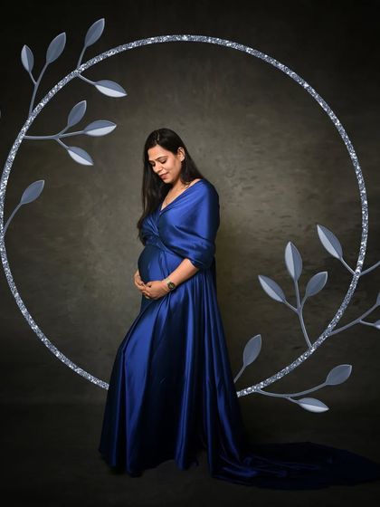 To add a touch of creative flair, I sometimes incorporate digital elements like this silver wreath to frame the portrait and enhance the artistic feel.