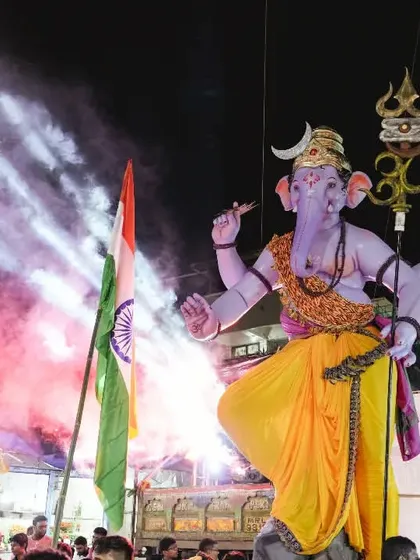 A dramatic night shot from the Kopri Cha Samrat procession. Using colored smoke and spotlights, I framed the massive idol to create a powerful and memorable image that reflects the festival's high energy.