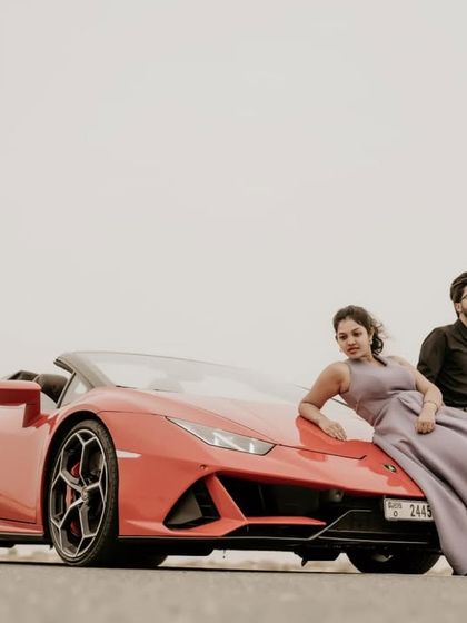 A wide shot showing the scale of the Lamborghini against the vast desert landscape.