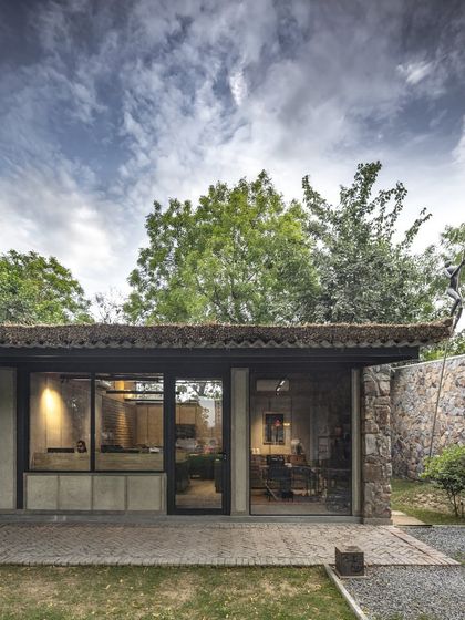 Our studio, featured in Architecture + Design, is a testament to our belief in context. The building itself, with its stone walls and large glass openings, engages in a constant dialogue with the surrounding landscape.