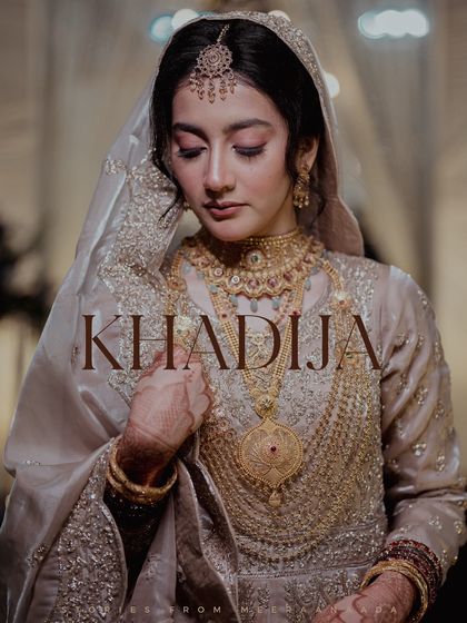 A beautiful portrait of a Muslim bride, showcasing her intricate gold jewelry and elegant attire.