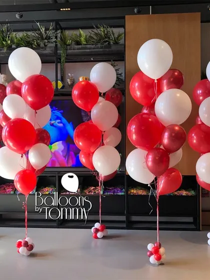 Simple yet effective, these classic red and white balloon bunches are perfect for grand openings, sales events, or product launches. They are a cost-effective way to fill a space with color and draw attention to your brand.