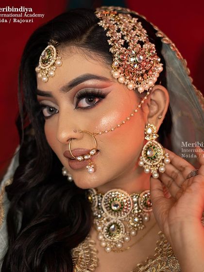 A close-up showcasing the winged eyeliner and beautifully blended eyeshadow, which are hallmarks of a sophisticated Pakistani bridal look.